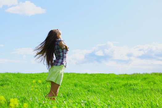 woman on summer green field feel freedom