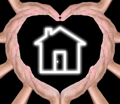 house icon in hands created heart