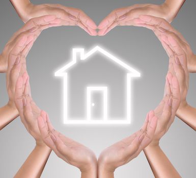 house icon in heart hand