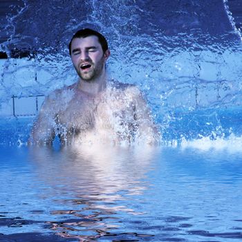 young attractive man relax in spa area