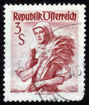 AUSTRIA - CIRCA 1949: A stamp printed in Austria shows a woman in the Austrian national dress , inscription "Burgenland" from the series "Costumes", circa 1949