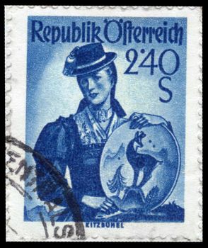 AUSTRIA - CIRCA 1951: A stamp printed in Austria, shows a woman in national dress, Tyrol, inscription Kitzbuhel from the series "Costumes" , circa 1951