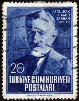 Turkey-CIRCA 1952: stamp printed in Turkey, shows images of Turkish writer Abdulhak Hamid Tarhan, is dedicated to the centenary of his birth, circa 1952