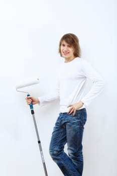 Portrait of young man with paint brushes