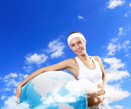 Portrait of a young woman doing sport with a bottle of pure water