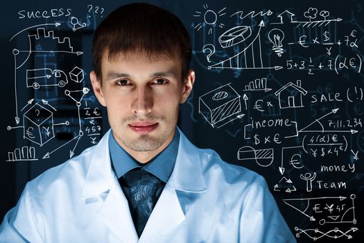 Young scientist in laboratory in white uniform