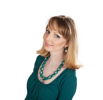 beauty portrait of a blonde in a green dress isolated on white background