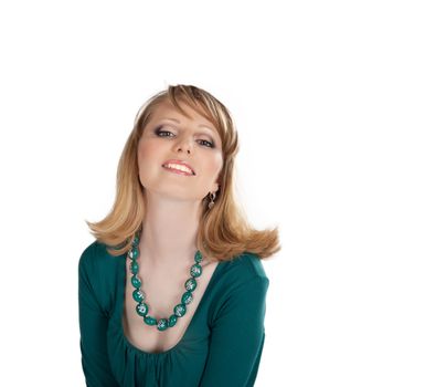 beauty portrait of a blonde in a green dress isolated on white background