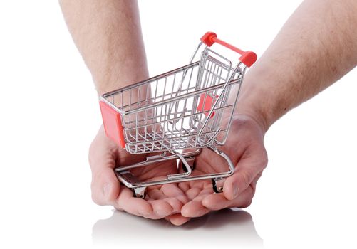 Hand holding shopping cart trolly isolated on white, concept of shopping at your finger tips