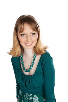 beauty portrait of a blonde in a green dress isolated on white background