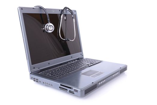 Stethoscope and laptop  isolated on white background