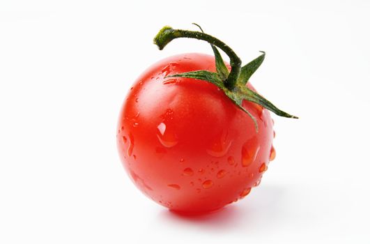 An image of fresh red tomato on white background