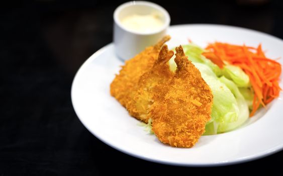 Fried shrimp salad food on white dish