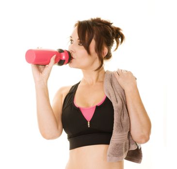 woman drinking from a sports bottle after a workout isolated on white