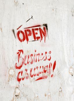 business open as usual painted on wodden board