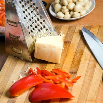 Stock photo: an image of food in the kitchen: mushrooms, paprika and cheese