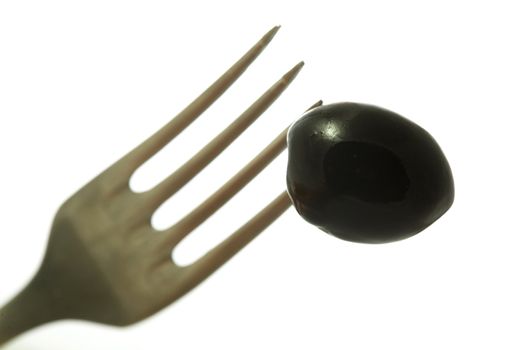 Stock photo: an image of olive on the fork