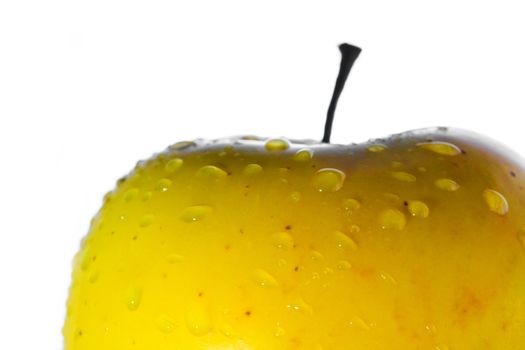 Stock photo: nature theme: an image of water drops on a yellow apple