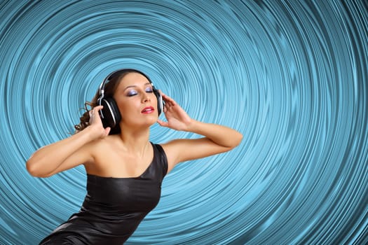 Portrait of young woman with headphones and glittering background