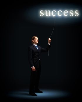 Light bulb and a business person as symbols of creativity in business