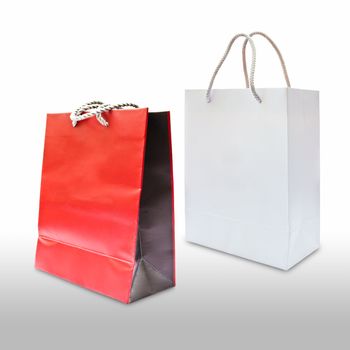 red and white paper shopping bag isolated