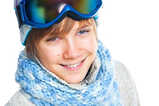 Clouse up portrait of a caucasian cute teenager in ski goggles and a scarf, isolated on white. Vertical view
