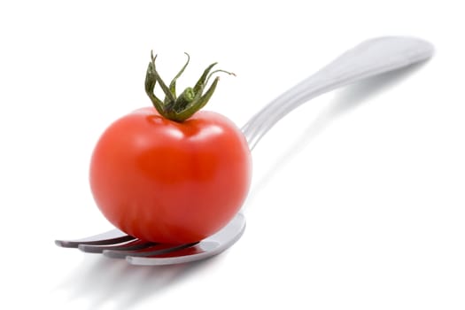 tomato on fork isolated