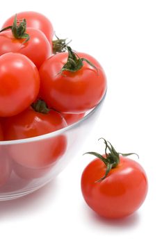 ripe tomatoes in glass bowl isolated