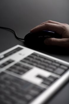 keyboard and fingers over mouse