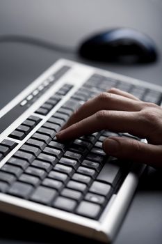 fingers over keyboard