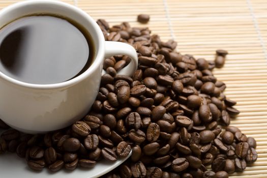 cup of coffee and coffee beans

