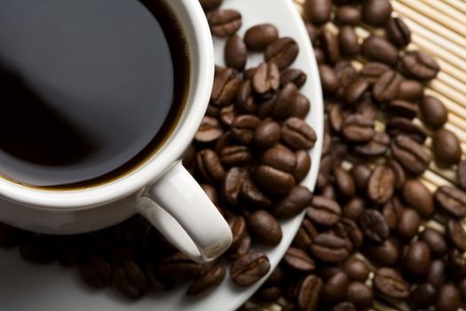 cup of coffee and coffee beans