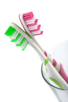 two colorful toothbrushes isolated