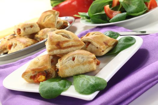 savory pastry snacks filled with red pepper and vegetables