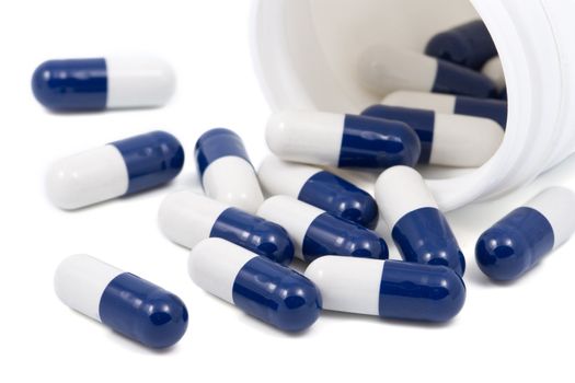 blue and white capsule pills