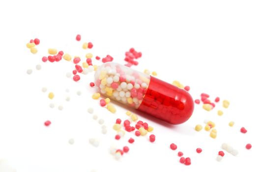 red and white capsule pill isolated