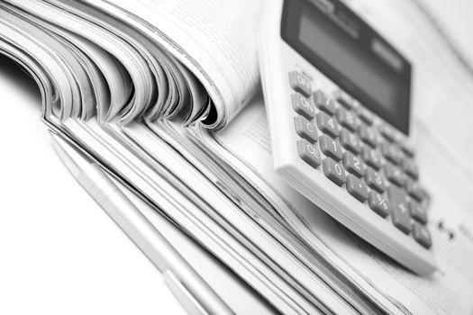newspapers, pen and calculator. business background
