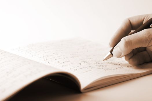 hand writing in notebook