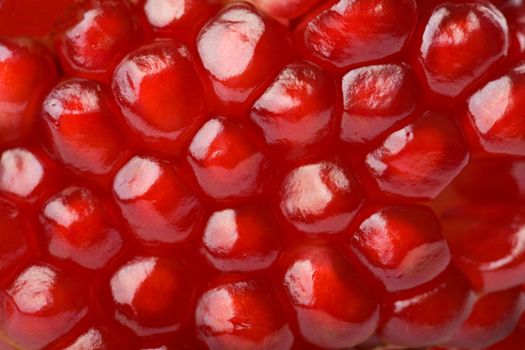 macro of ripe seeds pomegranate isolated