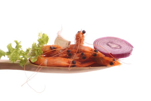 Shrimp  simply offered on a wooden spoon isolated on a white background 