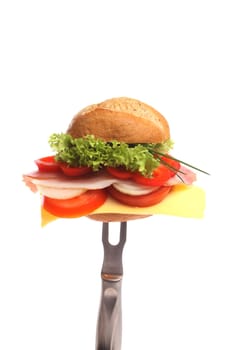 Bread roll for breakfast covered with healthy fresh ingredients