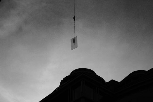 A glass plate lifted during construction.