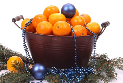 Mandarins and christmas balls over white