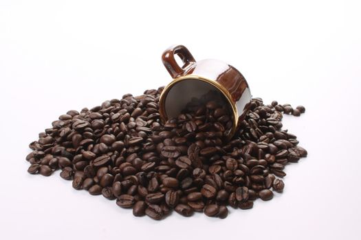 Roasted coffee beans  and a coffee cup and a Dutch flag