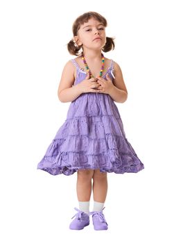 A little dissatisfied girl in a lilac dress on a white background