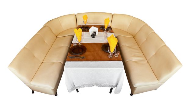 Comfortable leather beige sofa and a table in a restaurant