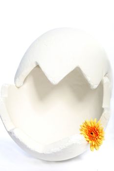 large egg decorated with flowers on white background