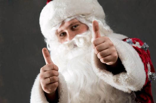 Santa Claus is preparing to celebrate Christmas. Showing tumb