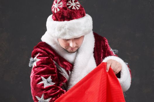 Santa Claus carrying a red bag
