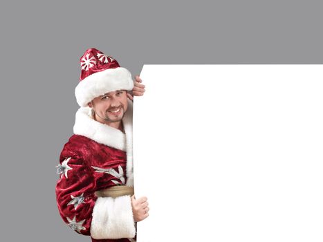 Santa Claus carrying a shield for advertisement
